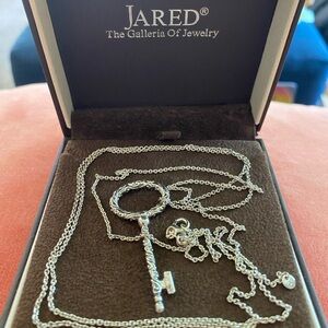 Jared sterling silver key with extra long, adjustable sterling silver necklace.